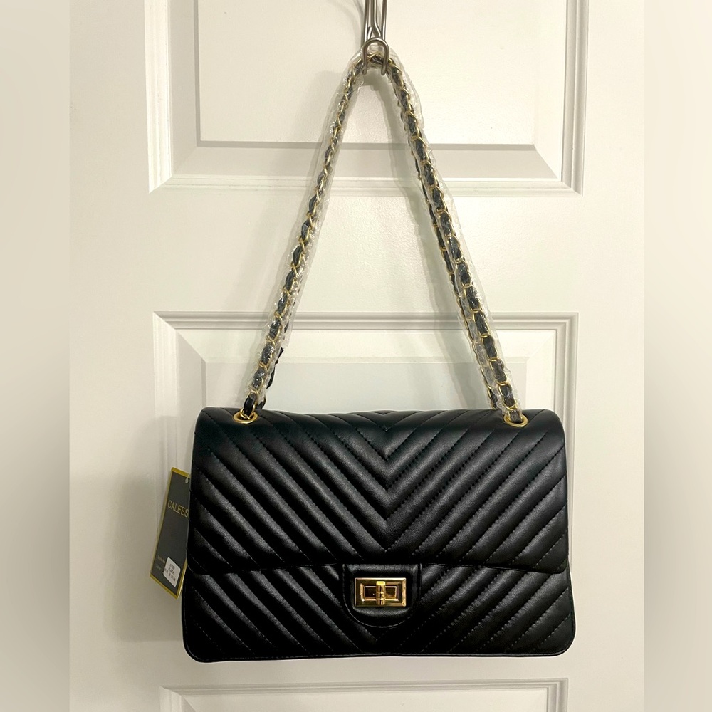 Brand new boutique black and gold purse!